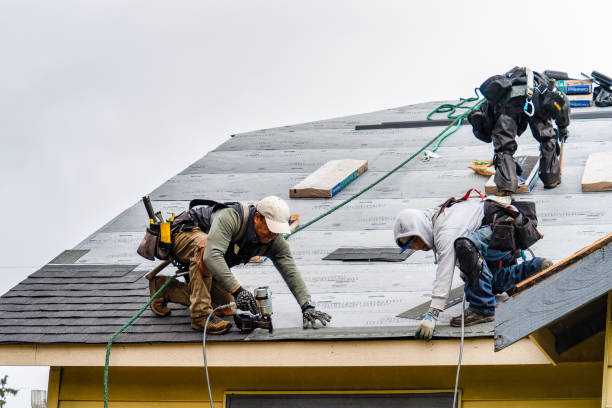 Professional Roofing technician working in North Hampton, NH
